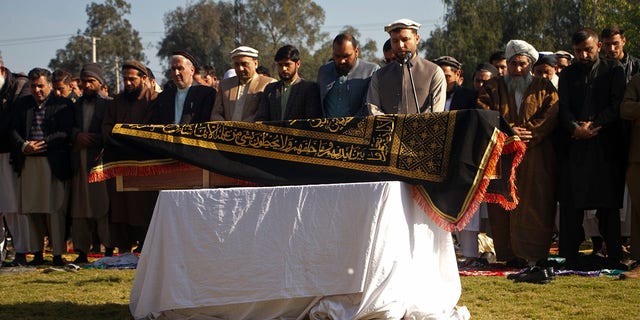 Afghans pray for TV anchor Malala Maiwand who was shot and killed by gunmen soon after she left her house early Thursday, during her funeral ceremony in Jalalabad, east of Kabul, Afghanistan, Thursday, Dec. 10, 2020. (AP Photo)