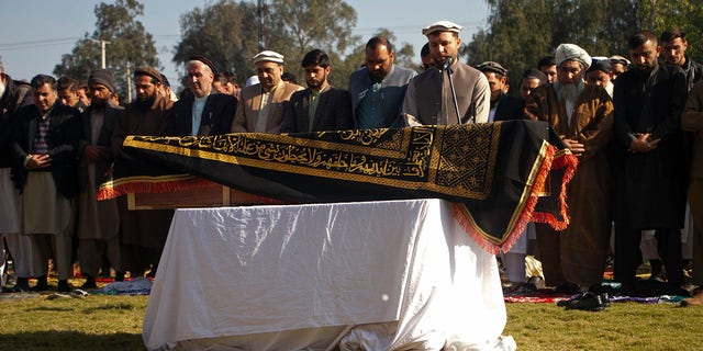 Afghans pray for TV anchor Malala Maivand, who was shot and killed by gunmen after leaving her home on Thursday morning, at her funeral ceremony in Jalalabad, east of Kabul, Afghanistan, on Thursday, December 10, 2020 during.  (AP photo)