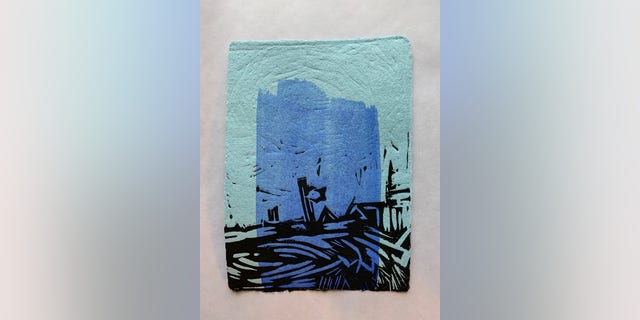 A Hero’s Painting-A Tribute to John Lewis. Artwork by veteran and artist Mark Oldland on blue healthcare workers' scrubs.