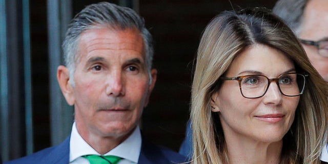 Actor Lori Loughlin, and her husband, fashion designer Mossimo Giannulli, leave the federal courthouse after facing charges in a nationwide college admissions cheating scheme, in Boston, Massachusetts, U.S., April 3, 2019. On Friday, Giannulli was reportedly released from home confinement. 