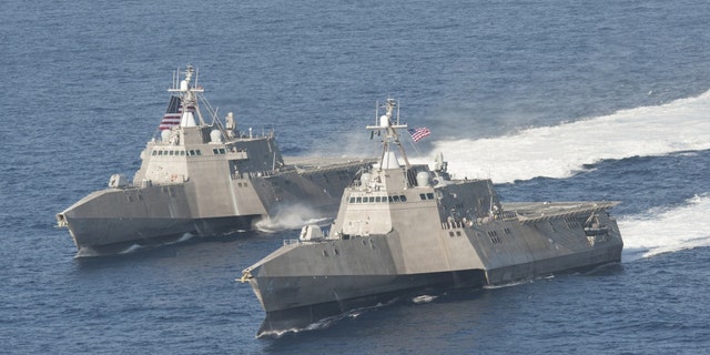 The littoral combat ships USS Independence (LCS 2), left, and USS Coronado (LCS 4) underway in the Pacific Ocean - file photo.