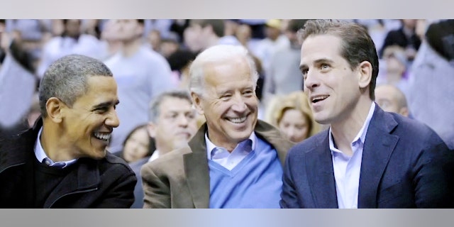 President Barack Obama, Vice President Joe Biden and Hunter Biden attend a college basketball game in Washington on Jan. 30, 2010. (AP Photo/Nick Wass, File)