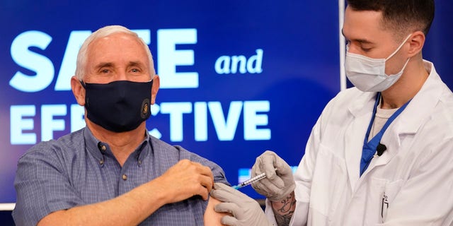 Vice President Mike Pence receives a Pfizer-BioNTech COVID-19 vaccine shot at the Eisenhower Executive Office Building on the White House complex, Friday, Dec. 18, 2020, in Washington.