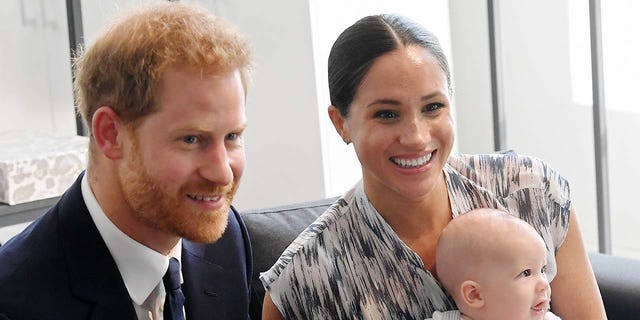 Prince Harry (left) and Meghan Markle (right) have shared theri Christmas card, featuring their 1-year-old son Archie, with the animal welfare charity Mayhew. (Photo by Toby Melville - Pool/Getty Images)