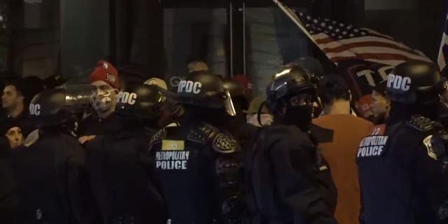 D.C. police worked to separate Trump supporters and far-left demonstrators who converged in the street on the night of Dec. 12. 