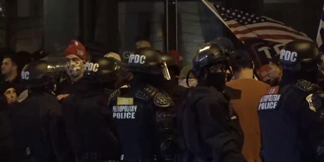 D.C. police worked to separate Trump supporters and far-left demonstrators who converged in the street on the night of Dec. 12. 