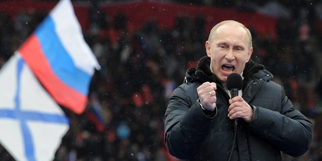 Russian Presidential candidate, Prime Minister Vladimir Putin delivers a speech during a rally of his supporters at the Luzhniki stadium in Moscow on Feb. 23, 2012.  (Photo credit should read YURI KADOBNOV/AFP via Getty Images)