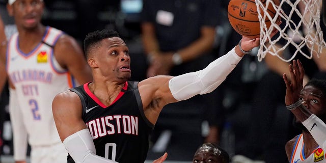 In this Wednesday, Sept. 2, 2020 file photo, the Houston Rockets' Russell Westbrook (0) goes up for a shot as the Oklahoma City Thunder's Nerlens Noel, right, defends during the second half of an NBA first-round playoff basketball game in Lake Buena Vista, Fla. (AP Photo/Mark J. Terrill, File)