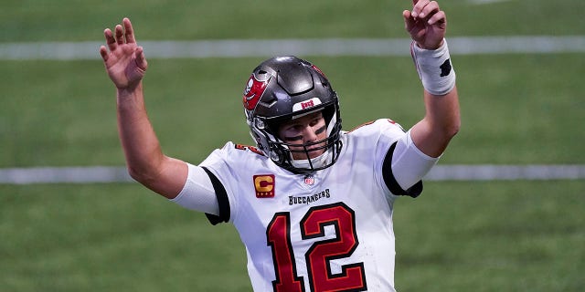 Tampa Bay Buccaneers quarterback Tom Brady (12) reacts after a Tampa Bay Buccaneers touchdown against the Atlanta Falcons during the second half of an NFL football game, Sunday, Dec. 20, 2020, in Atlanta. (AP Photo/John Bazemore)