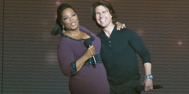 Tom Cruise jumped up on Oprah Winfrey's couch to profess his love for Katie Holmes during an appearance on 'The Oprah Winfrey Show.' (Photo by Timothy Hiatt/FilmMagic)
