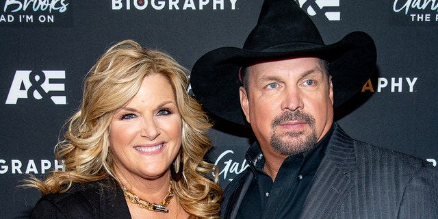 Country star Trisha Yearwood (left) has tested positive for coronavirus while her husband, Garth Brooks (right) tested negative. (Photo by Roy Rochlin/WireImage)