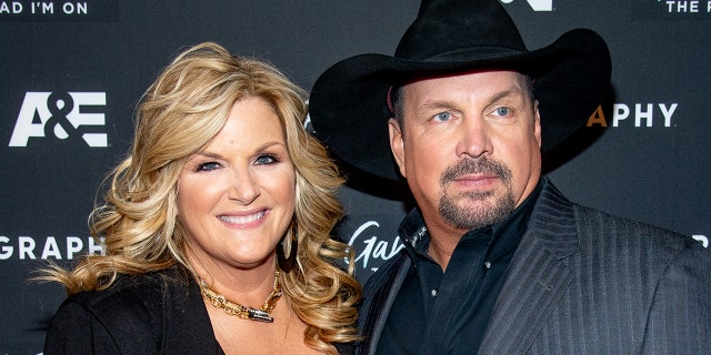 Country star Trisha Yearwood (left) tested positive for coronavirus, while her husband, Garth Brooks (right), tested negative.  (Photo by Roy Rochlin / WireImage)