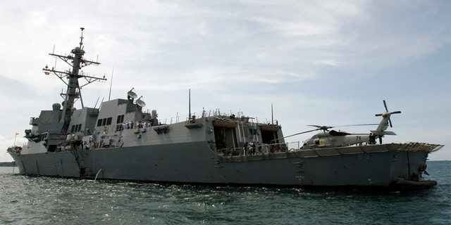  The warship USS Mustin sails near the port in Sihanoukville,  139 miles west of Phnom Penh, Oct. 11, 2008. The USS Mustin is in Cambodia to strengthen bilateral ties between the U.S. and Cambodia, and to carry out humanitarian and medical missions for locals, a U.S. embassy spokesman said. REUTERS/Stringer  