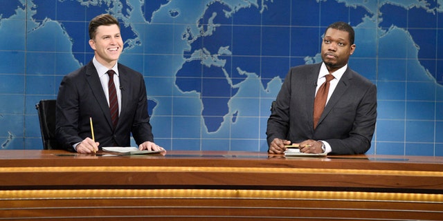 "Saturday Night Live" Weekend Update anchors Colin Jost, left, and Michael Che are seen Dec.12, 2020. (Will Heath/NBC)