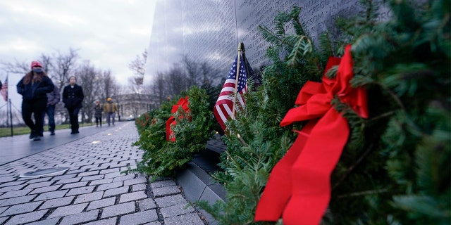 A wreath stands at the Vietnam Veterans Memorial as part of Wreaths Across America, Friday, December 18, 2020, in Washington. (AP Photo / Manuel Balce Ceneta)