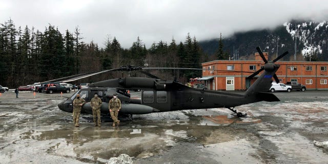 An Alaska Army National Guard UH-60 Black Hawk helicopter has assisted with search and rescue after the landslide. (Alaska Army National Guard via AP)