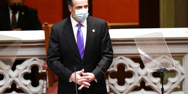 New York Gov. Andrew Cuomo speaks to members of New York state's Electoral College before voting for president and vice president in the Assembly Chamber at the state Capitol in Albany, N.Y., Monday, Dec. 14, 2020. (AP Photo/Hans Pennink, Pool)