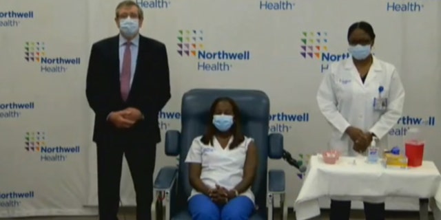 Sandra Lindsay, a critical care nurse at Long Island Jewish Medical Center, was the first in New York to receive the first dose of Pfizer's coronavirus vaccine.