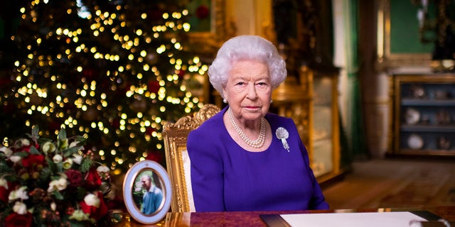 In this undated photo released on Friday, December 25, 2020, British Queen Elizabeth II records her annual Christmas broadcast in Windsor Castle, Windsor, England.  (Associated Press)