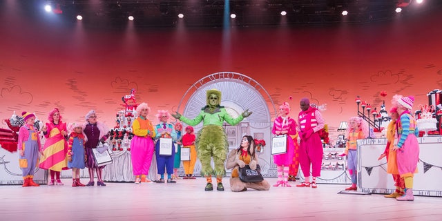 The cast of NBC's 'Dr. Seuss' The Grinch Musical!' donning colorful outfits as the whimsical residents of Whoville.