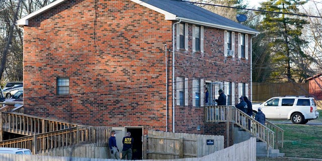 FBI and ATF agents search a home Dec. 26, 2020, in Nashville, Tenn. An explosion that shook the largely deserted streets of downtown Nashville early Christmas morning shattered windows, damaged buildings, and wounded three people. Authorities said they believed the blast was intentional.