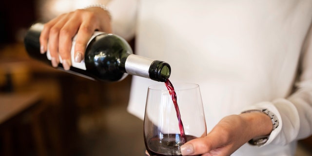 If you don't have a corkscrew to open a bottle of wine, one TikTok user suggests using a sneaker instead. (iStock)