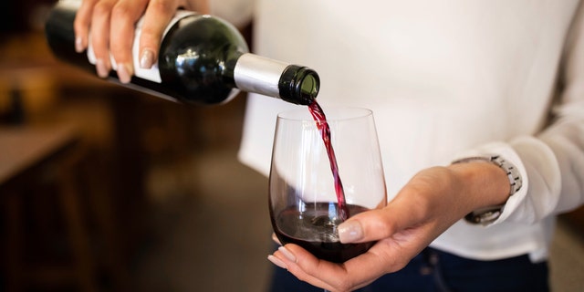 If you don't have a corkscrew to open a bottle of wine, one TikTok user suggests using a sneaker instead. (iStock)