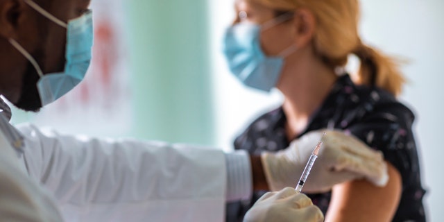 Vaccines are on the way, pending FDA approval, but officials are pleading with Americans to still follow public health measures. (iStock)