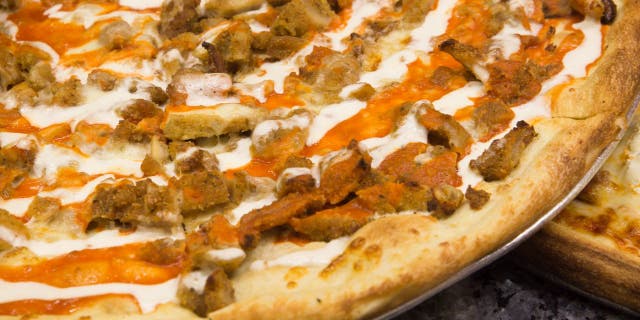 Buffalo chicken pizza offers a protein-based topping with a touch of tangy sauce. (iStock)