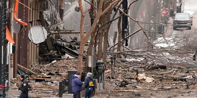 Emergency personnel work near the scene of an explosion in downtown Nashville, Tenn., Dec. 25. (AP Photo/Mark Humphrey)