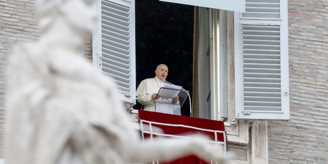Pope Francis delivering a blessing over St.Peter's Square at the Vatican in December 2020.