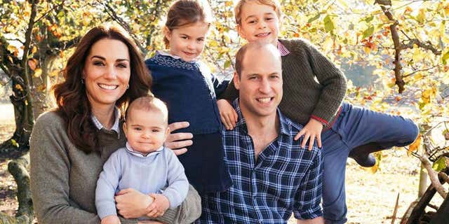 Kate Middleton and Prince William pose for a photo with their three children: George (right), Charlotte (middle) and Louis.