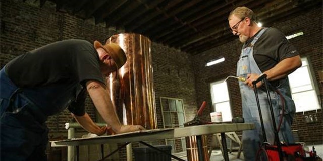 Distilling partners Mark Ramsey (left) and Digger Manes chronicle their adventures in the new season of Discovery’s "Moonshiners" which details how 2020 has been a surprisingly prosperous year for the spirit.