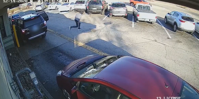 Leon Taylor is seen fleeing from a car waiting to pay at a McDonald's drive-thru.