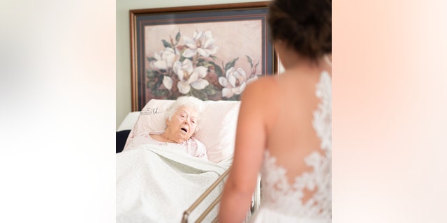 In the series of moving photos taken at Beaman’s home in Wilson, the grandmother gasped upon seeing Boykin in her white dress.