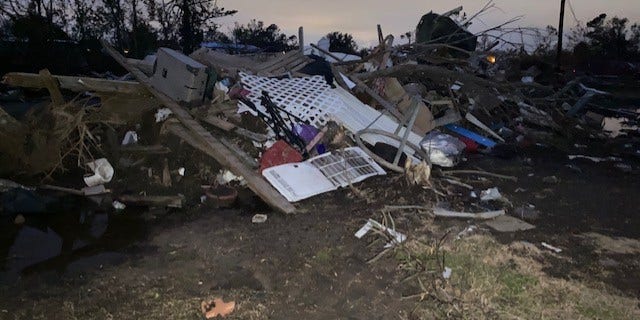 The smith family's mobile home is now a pile of debris on the side of the road following the category 4 storm.