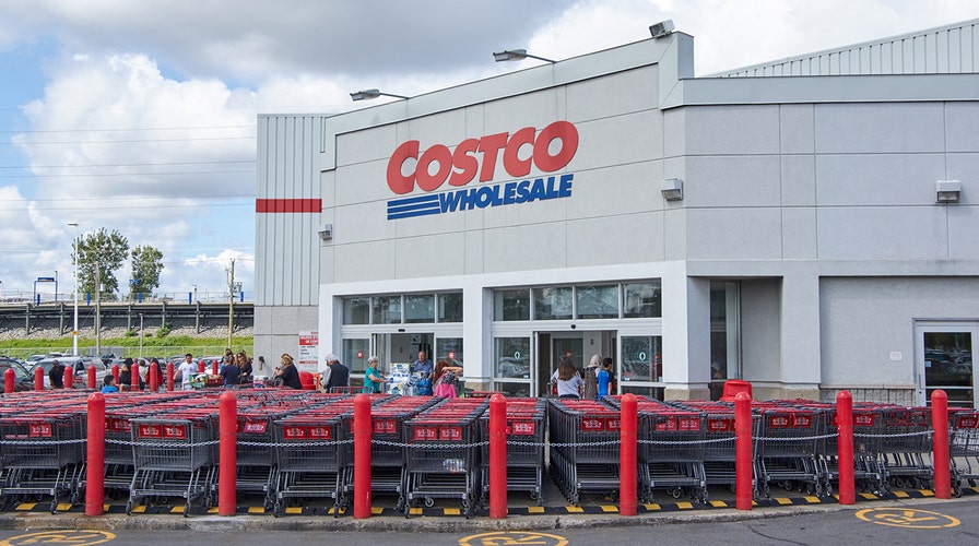 Couple take wedding photos at Costco where they first met