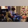 In Fort Worth, Texas Grandpa Bud Holladay explains the story behind treasured family Christmas ornaments to grandson Brody Lewis.