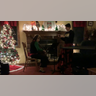 Bridget Brown playing cello for her schools virtual string Christmas concert. Her Brother Brody Brown video recording it to be played with all her band mates.