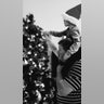 I have attached a photo of my husband and grandson decorating the tree during our visit to Steamboat Springs, Colorado over Thanksgiving. Sue Burnett