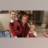 The Edmondson family. Christmas dinner. Dad dressed as Santa.