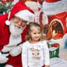 This is my 2 year old granddaughter Nyla seeing Santa this year. We are from Indiana, Nyla loves the holidays and is hoping for snow and lots of toys!