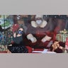 My Granddaughter Maeve Eyre has always gone to the same Santa Claus. This year she had a picture taken with Santa behind plexiglass. It did not seem to bother her at all.