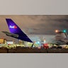 In this late Sunday, Dec. 13, 2020, photo provided by Los Angeles World Airports, crews unload a FedEx Airbus A300F4-605R carrying the first batch of COVID-19 vaccine arriving in Los Angeles, at Los Angeles International Airport.
