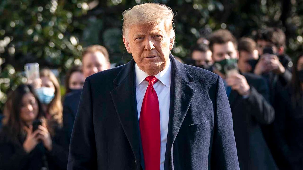 President Trump turns to reporters as he exits the White House to walk toward Marine One on the South Lawn on Jan. 12, 2021 in Washington, D.C. (Getty Images)