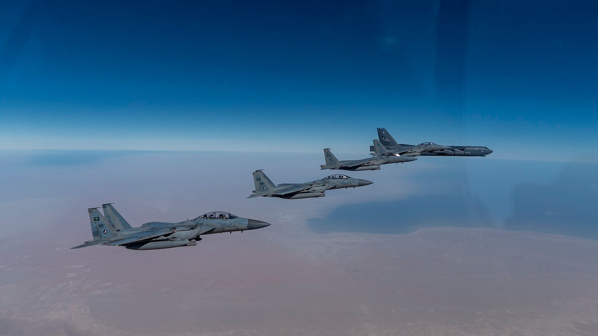 A U.S. Air Force B-52 Stratofortress from the 2nd Bomb Wing, Barksdale Air Force Base, LA, flew with Royal Saudi Arabian Air Force F-15SAs during a bomber task force mission over the U.S. Central Command area of responsibility, Jan. 27, 2021. (U.S. Air Force photo by Senior Airman Roslyn Ward)