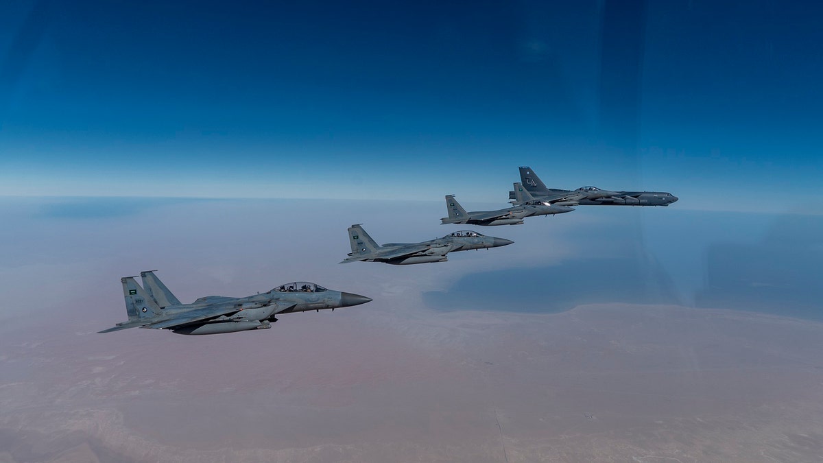A U.S. Air Force B-52 Stratofortress from the 2nd Bomb Wing, Barksdale Air Force Base, LA, flew with Royal Saudi Arabian Air Force F-15SAs during a bomber task force mission over the U.S. Central Command area of responsibility, Jan. 27, 2021. (U.S. Air Force photo by Senior Airman Roslyn Ward)