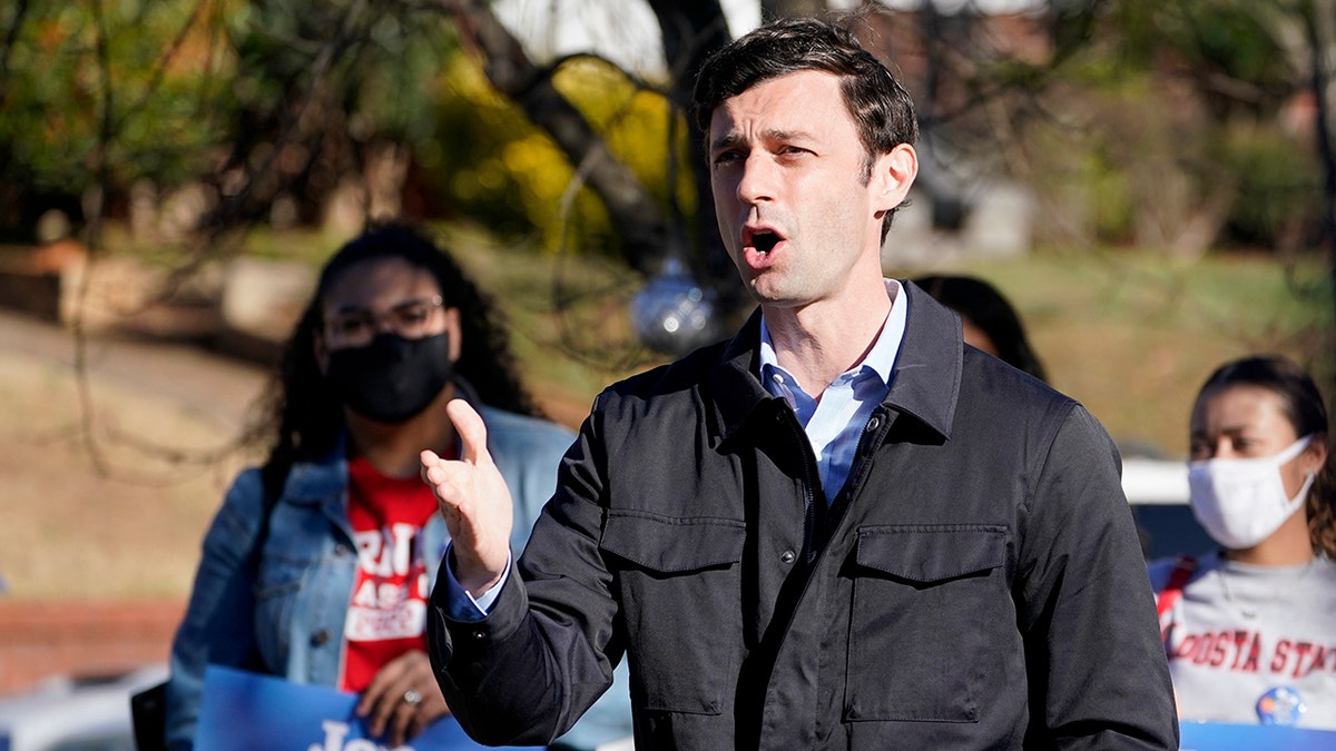 Democratic nominee for U.S. Senate from Georgia Jon Ossoff speaks after voting early in Atlanta on Tuesday, Dec. 22, 2020.  (AP Photo/John Bazemore)