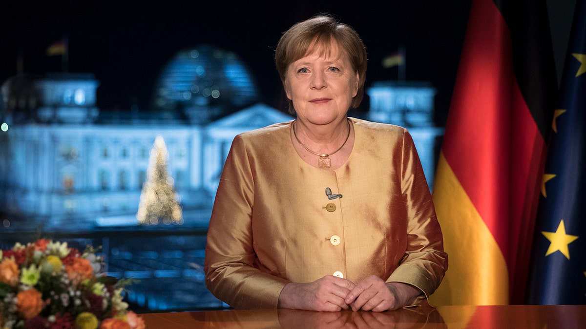 Angela Merkel in gold outfit at chancellery in Berlin