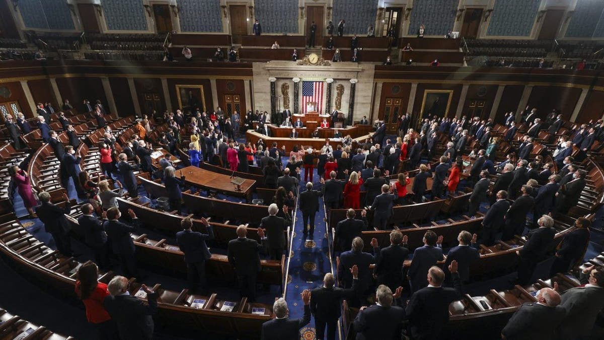 House Speaker Nancy Pelosi administers the oath of office to members of the 117th Congress at the U.S. Capitol in Washington, Sunday, Jan. 3, 2021. (Tasos Katopodis/Pool via AP)